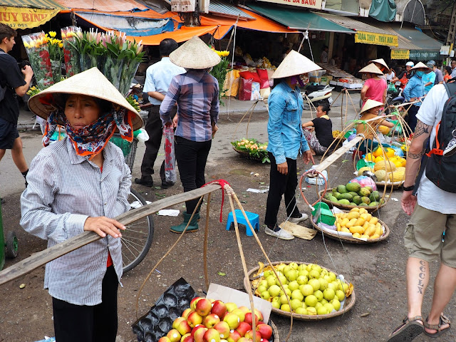 Street vendors selling fruit in the Old Quarter of Hanoi, Vietnam