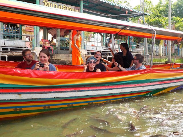 Cruising in a long tail boat around the canals of Bangkok, Thailand