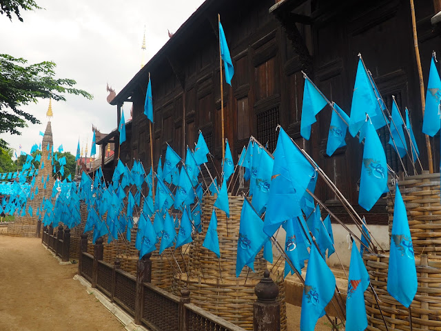 Blue flags outside Wat Phan Tao in Chiang Mai, Thailand