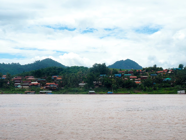 Village houses on the bank of the Mekong river in Laos