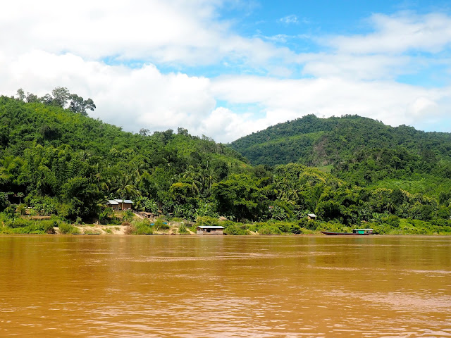 Houses and boats on the banks of the Mekong river, Laos