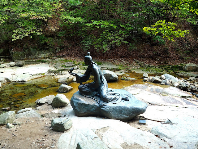 Statue of princess and snake by the river at Cheongpyeongsa temple, outside Chuncheon, South Korea