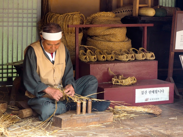 Making traditional straw shoes - demonstration and workshop in the Korean Folk Village, Yongin, Gyeonggi-do, South Korea
