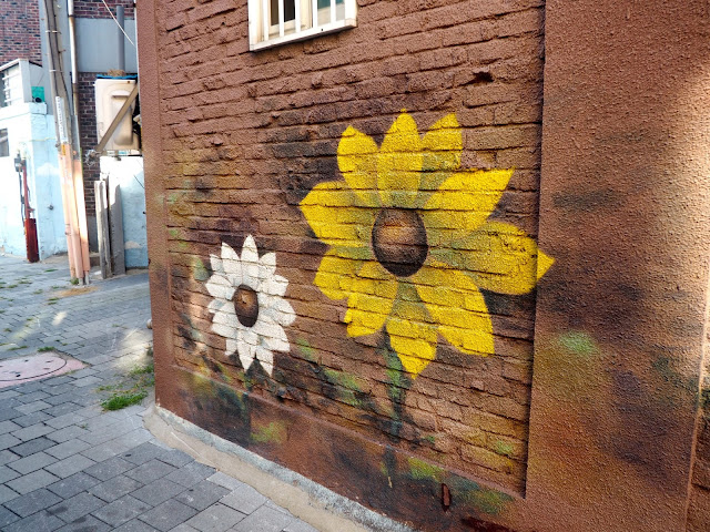 Sunflower street art in the Haenggung-dong mural village in Suwon, South Korea