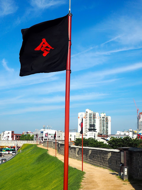 Black flags on the Hwaseong fortress walls around Suwon, Gyeonggi-do, South Korea