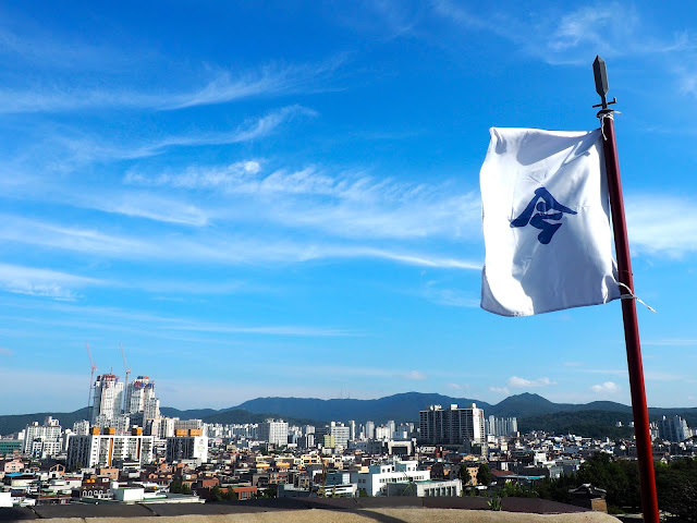 White flag and the view of Suwon from Hwaseong fortress walls around Suwon, Gyeonggi-do, South Korea