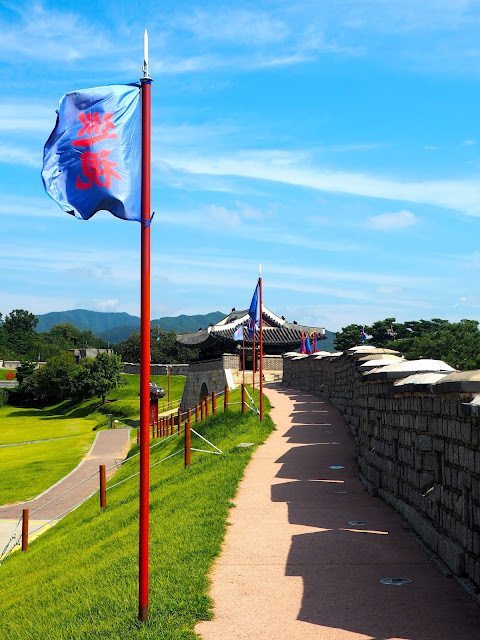 Blue flags along the Hwaseong Fortress walls around Suwon, Gyeonggi-do, South Korea