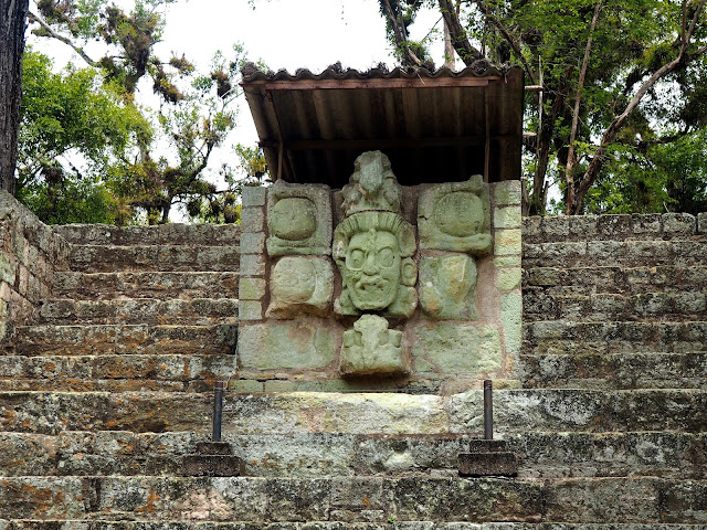 Mayan face statue carving at the temple ruins outside Copan, Honduras