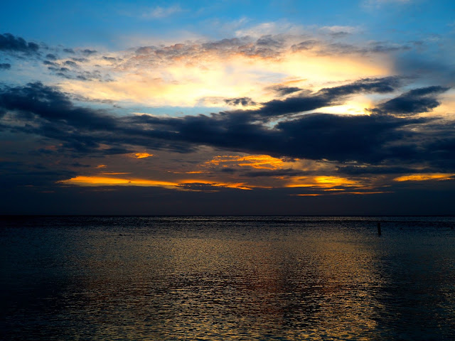 Cloudy sunset sky over the ocean from West Bay Beach, Roatan Island, Honduras