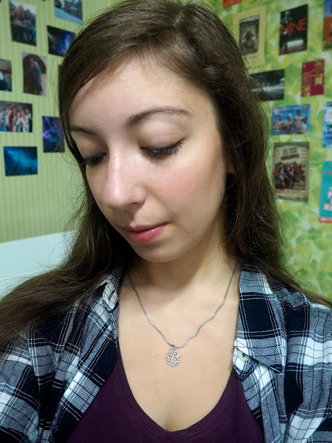 Checked Out - outfit details of silver tree of life necklace, worn with blue and white checked shirt and purple t-shirt