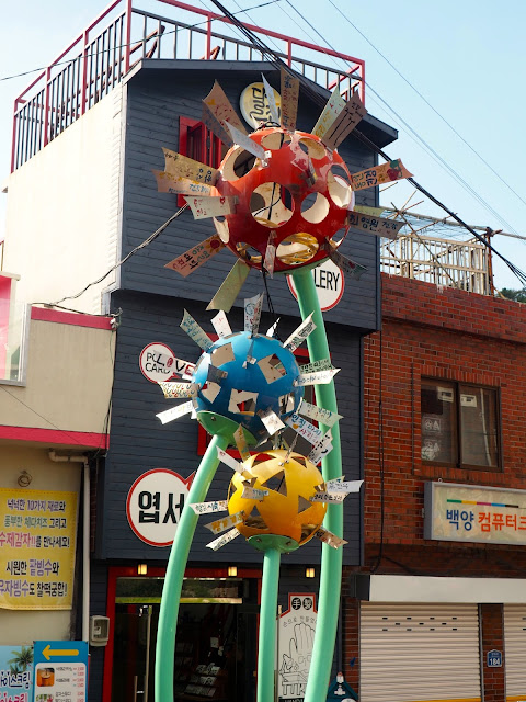 "Sweet Whispers of Dandelions" metal flower art installation in Gamcheon Village, Busan, South Korea
