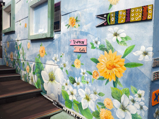 Flower mural and fish sign in Gamcheon Village, Busan, South Korea
