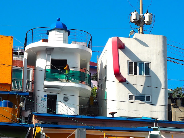 Lighthouse photo zone building and Book Cafe, building shaped like a mug, in Gamcheon Village, Busan, South Korea