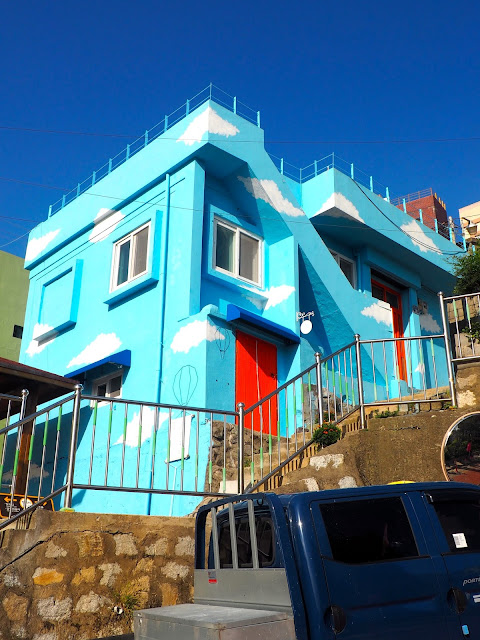 Building painted sky blue with clouds in Gamcheon Village, Busan, South Korea