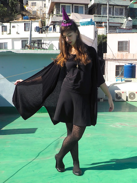 Witch Halloween Outfit | black t-shirt, skirt, ballet shoes and wide sleeved cardigan, spider web tights, and purple witch hat headband
