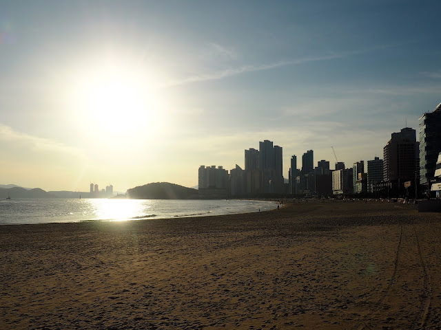 Late afternoon sunlight with silhouettes of buildings at Haeundae beach, Busan, South Korea