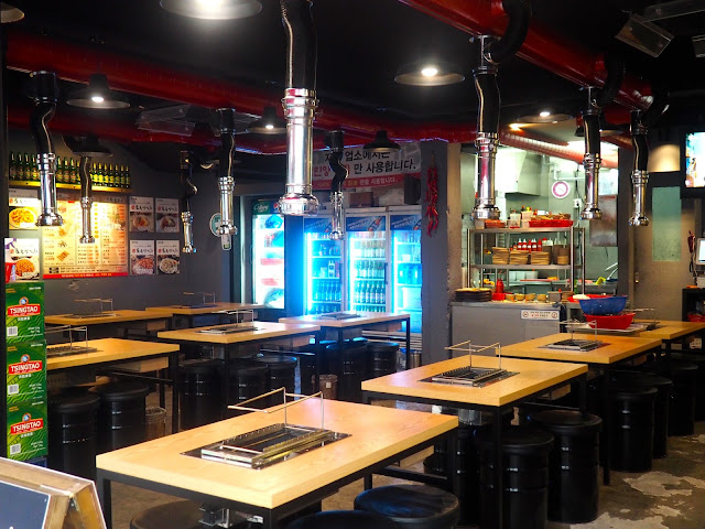 Interior of an empty Korean barbecue restaurant in Seomyeon, Busan, South Korea
