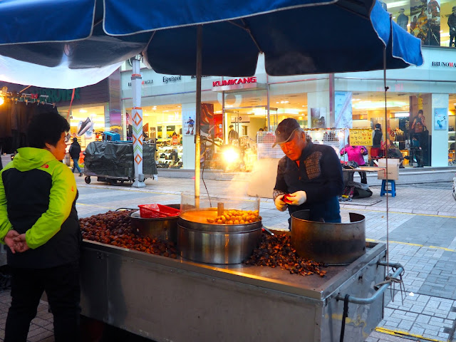 Street food seller roasting chestnuts in Seomyeon, Busan, South Korea