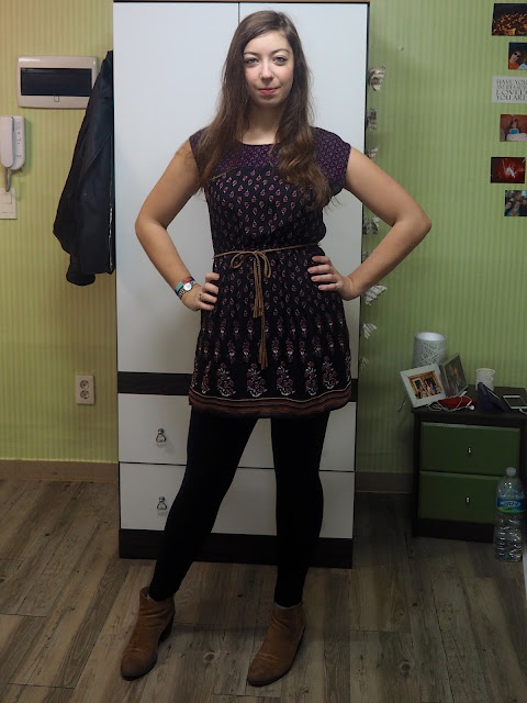 Purple Plum Patterns | outfit of short black dress with purple pattern and brown belt, worn with black leggings and brown ankle boots