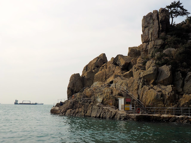 Rocky cliffs next to pebble beach in Taejongdae Park, Busan, South Korea
