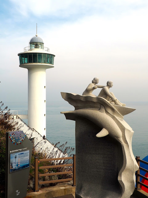 Yeongdo Lighthouse and statue in Taejongdae Park, Busan, South Korea