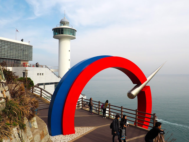Yeongdo Lighthouse with coloured archway in Taejongdae Park, Busan, South Korea
