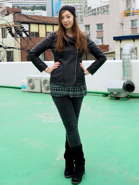 Beanie & Boots | outfit of black leather jacket, green print top, grey jeans, tall black suede boots & beanie hat