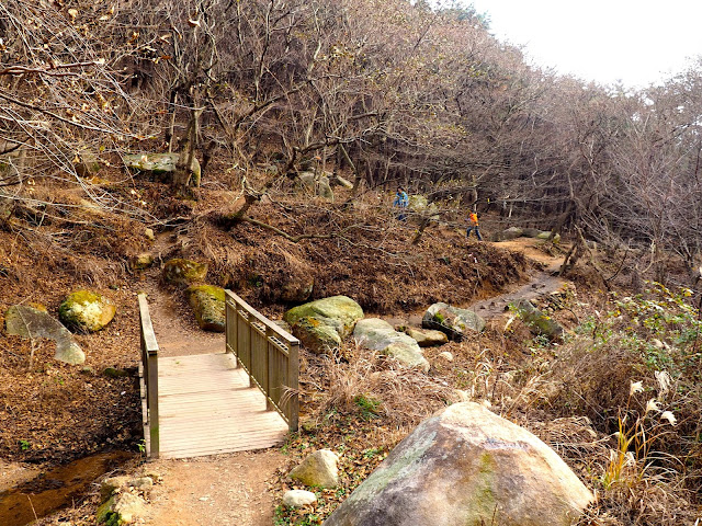 Small bridge crossing a stream on the hiking trail near Nammam Village on Geumjeongsan Mountain, Busan, South Korea