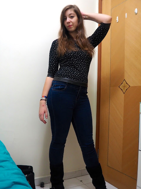 Triangular Touches - outfit of black top with white pattern and leather hems, high waist blue skinny jeans, and tall black suede boots
