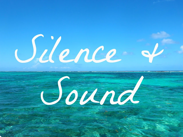 "Silence & Sound" text on background of turquoise ocean lagoon and blue sky near Caye Caulker, Belize