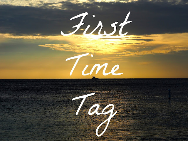 "First Time Tag' text on ocean sunset background