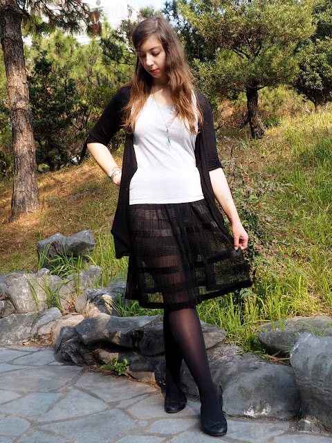 Balletic - outfit of plain grey t-shirt, black cardigan, long, floaty, sheer black skirt, with black tights and ballet flats