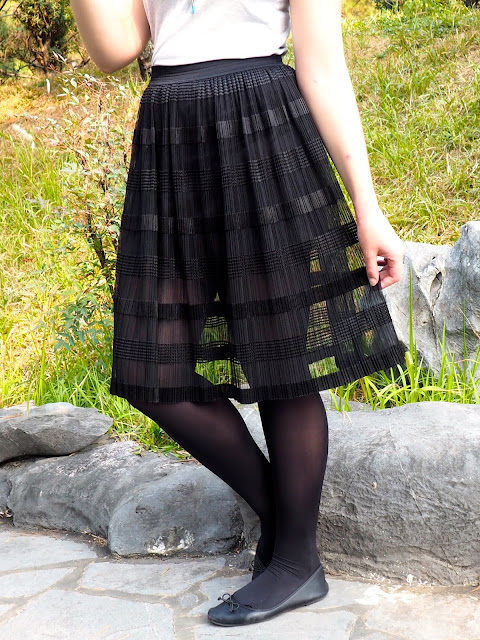 Balletic - outfit close-up of long, floaty, sheer black skirt, with black tights and ballet flats