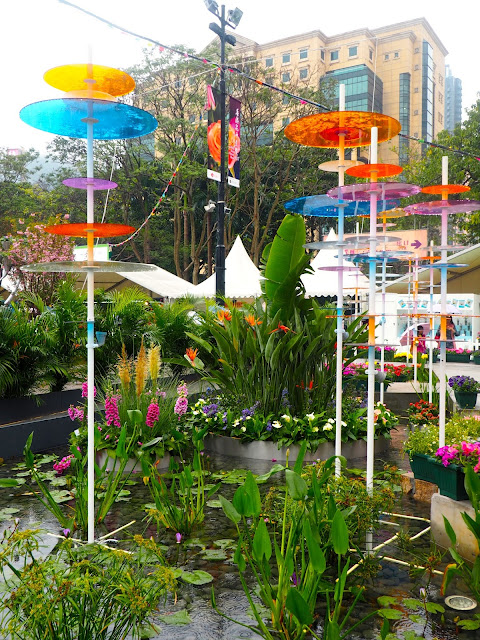 Pond with coloured glass discs - floral art installation at Hong Kong Flower Festival 2017