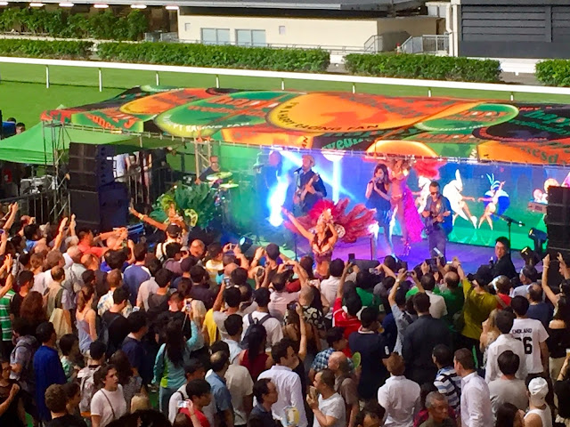 Samba carnival band & dancers at Happy Valley racecourse, Hong Kong