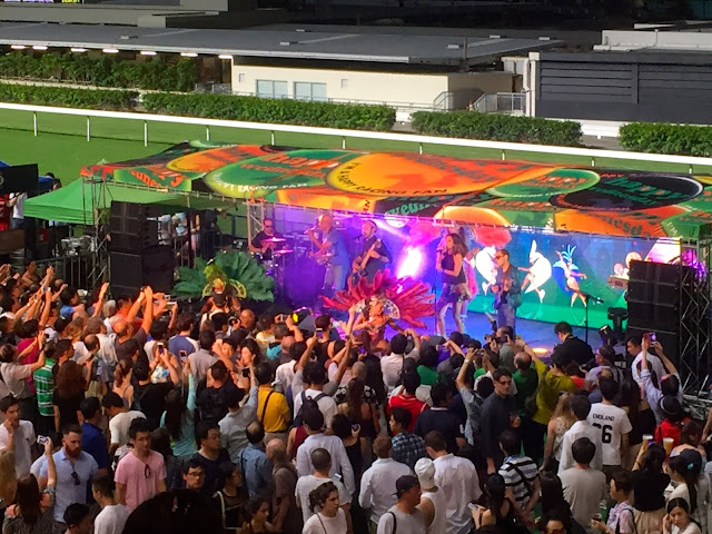 Samba carnival band & dancers at Happy Valley racecourse, Hong Kong