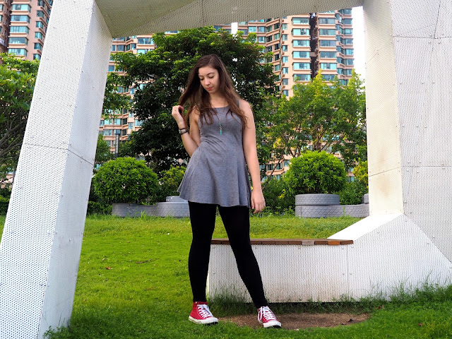 On The Move | outfit of short grey skater dress, black leggings, and red high top Converse