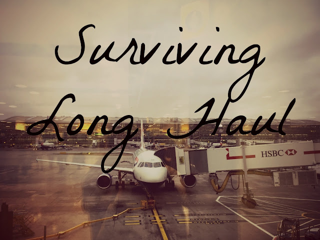"Surviving Long Haul" text on background of airplane with gate attached on airport runway beside terminal building