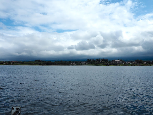 Mount Fuji behind clouds at Lake Kawaguchiko, Fuji Five Lakes, Japan
