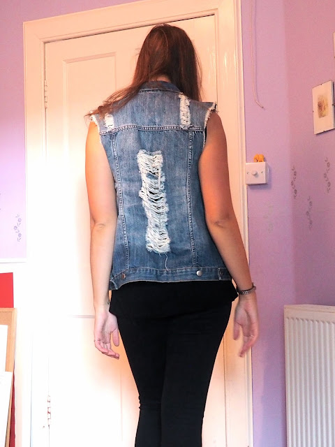 Rock 'n' Roll - outfit details - back of a ripped, over-sized denim waistcoat, with black skinny jeans