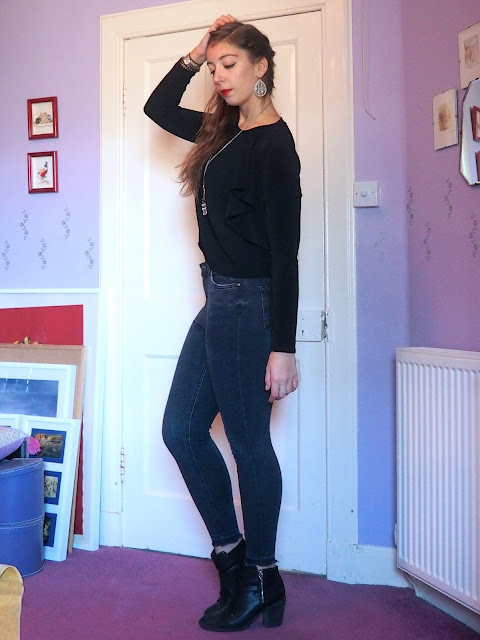 Back to Black | outfit of black shrug jacket & short top, grey skinny jeans & black heeled ankle boots