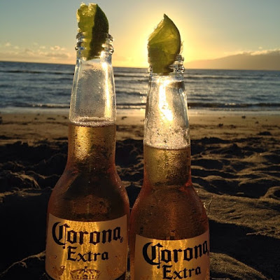 Corona beers with lime wedges on the beach