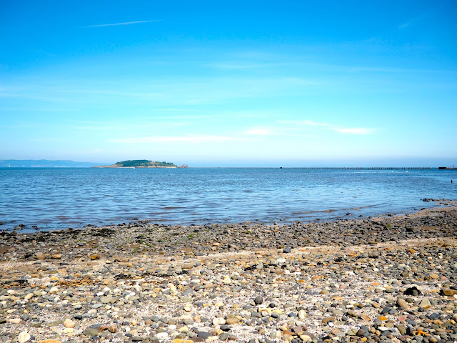 View out to Cramond Island and Firth of Forth from Dalmeny Estate Shore Walk in north Edinburgh