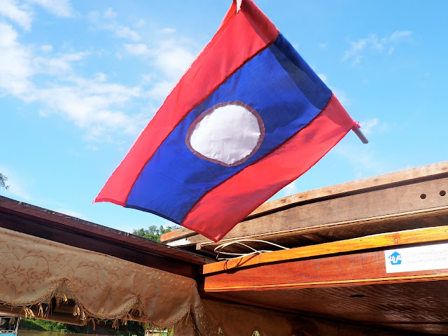 Mekong River boat with flag, Laos