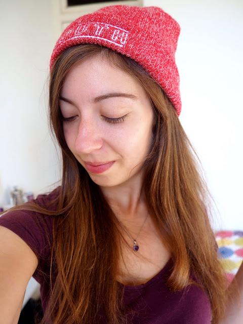 Aladdin inspired Disneybound outfit details of red beanie hat and purple heart necklace