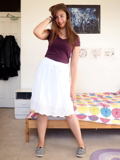 Aladdin inspired Disneybound outfit of dark purple top, long white skirt, and grey Toms shoes