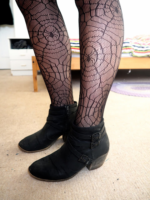 Evil Queen Disneybound villain outfit shoe details of black spider web tights and black heeled ankle boots