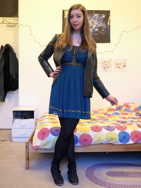 Merida inspired Disneybound outfit of short teal party dress with black leather jacket, tights and ankle boots