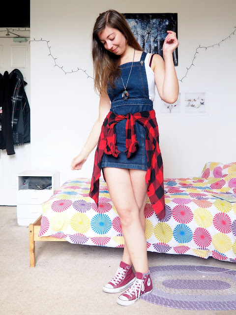 Spring Sunshine - outfit of denim dungaree dress, white top, red & black flannel checked shirt around the waist, and red Converse