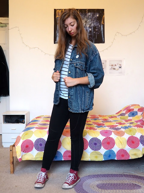 Vintage - outfit of second hand thrifted blue denim jean jacket, white striped top, black leggings & red Converse